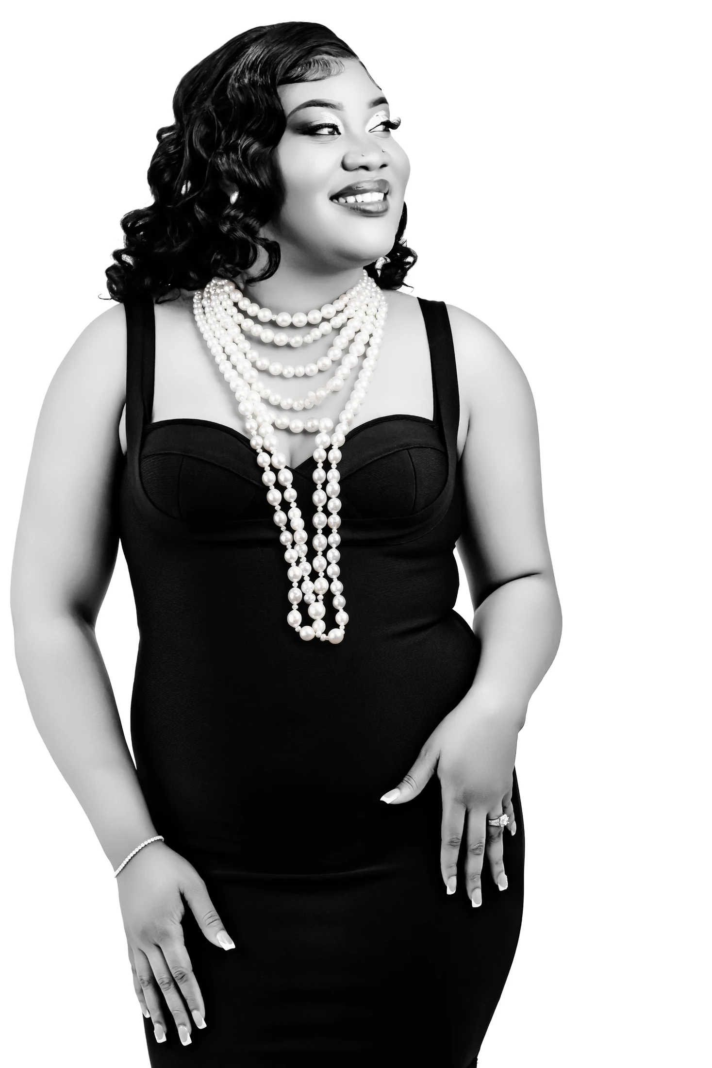 Editorial adult portrait in black with layered pearls